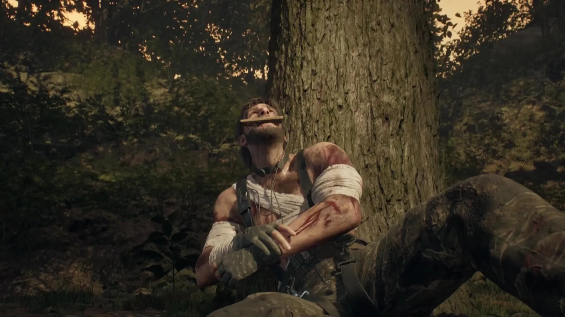 Snake bites on a piece of wood while setting his arm in Metal Gear Solid Delta Snake Eater.