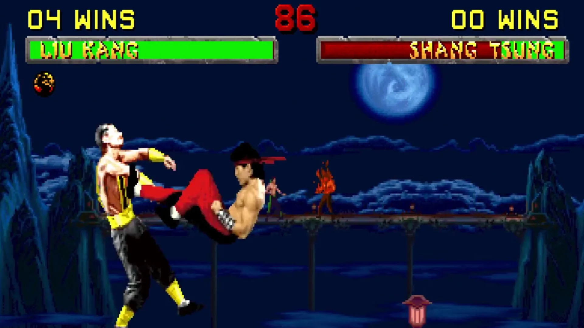 Liu Kang doing a bicycle kick on Shang Tsung in Mortal Kombat.